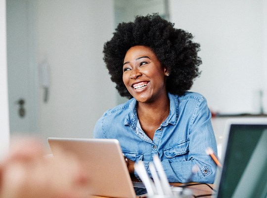 Woman smiling during work meeting in office