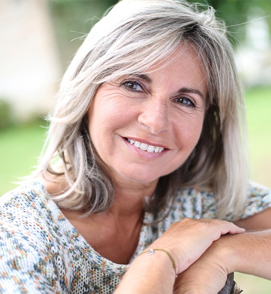 Smiling older woman outdoors