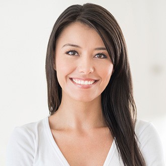 Young smiling woman in white shirt