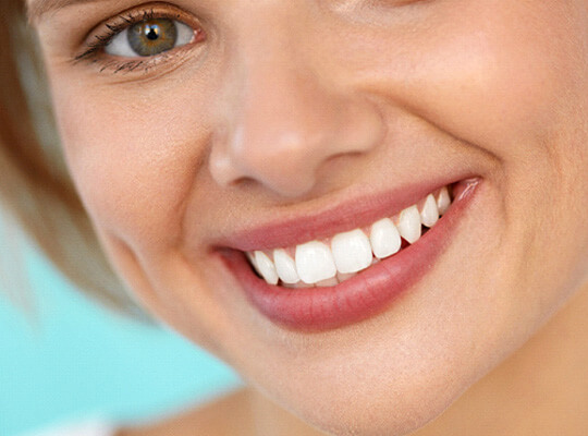 woman with hazel eyes smiling
