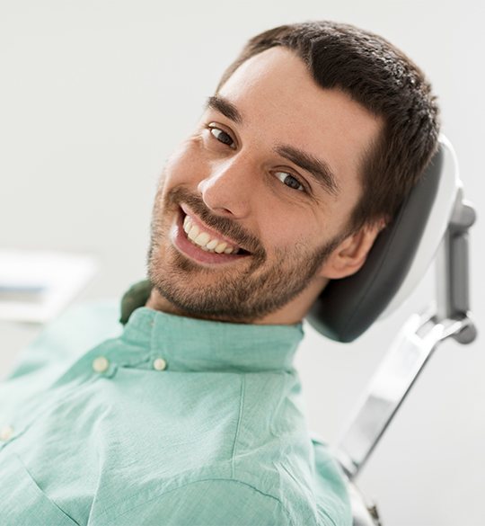 Smiling man in dental chair