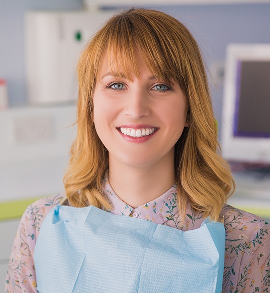 Woman in dental chair smiling