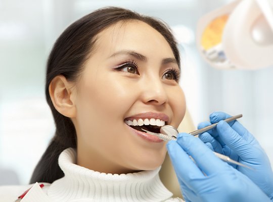 Woman receiving dental exam