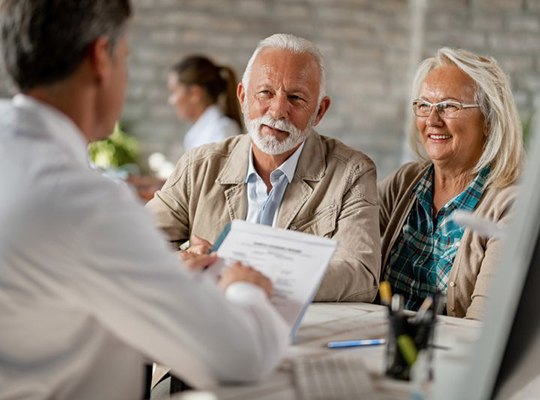 senior man and woman at an implant denture consultation 