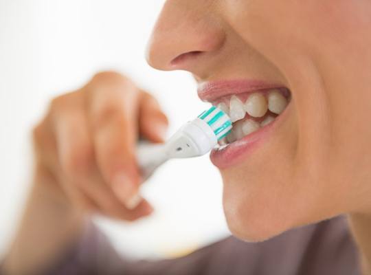 a person brushing their teeth