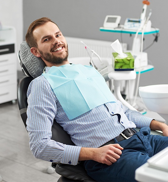 Smiling man in dental chair