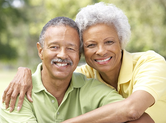 Smiling odler man and woman outdoors