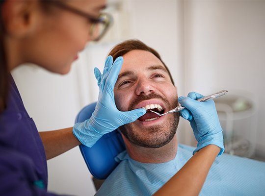 Man receiving dental exam