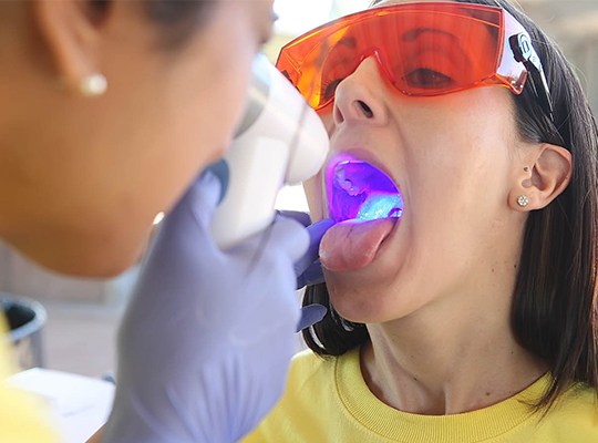 Patient receiving oral cancer screening