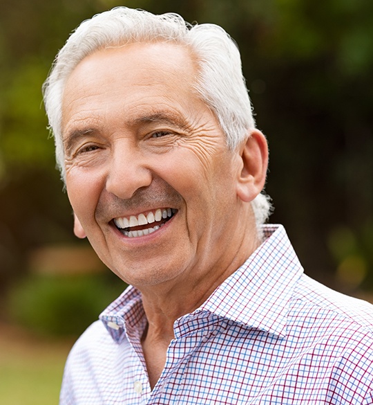 Laughing older man outdoors