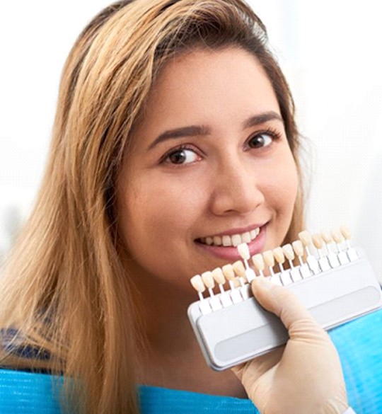 young woman getting veneers in Parma Heights