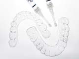 Take-home teeth whitening trays on white background