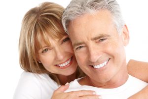 Smiling couple with Cerec one visit crowns